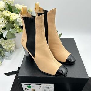 Women’s Chanel,cap toe leather ankle boots, size 37 made in Italy